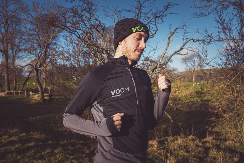 A male runner wearing a voom beanie